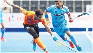 manpreet-singh-vying-for-the-ball-in-an-international-match-with-a-rival-defender