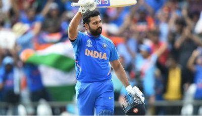 Rohit Sharma raising bat after reaching a milestone