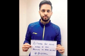 Parupalli Kashyap Campaigning to fight asthma with a placard