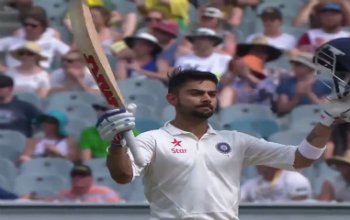 virat-kohli-century-celebration-with-bat-in-one-hand-helmet-in-other