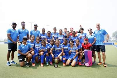 Indian-Junior-women's-hockey-team-posing-with-the-trophy