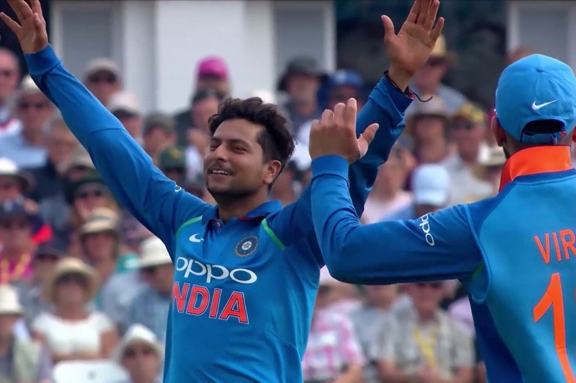 Kuldeep-Yadav-celebrating-a-wicket-with-arms-raised