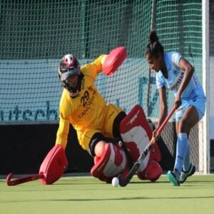 Indian-womens-hockey-striker-Mumtaz-Khan-tries-to-score-past-goalkeeper