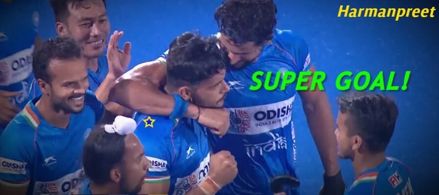 indian-hockey-player-harmanpreet-singh-surrounded-by-teammates-after-scoring-a-goal
